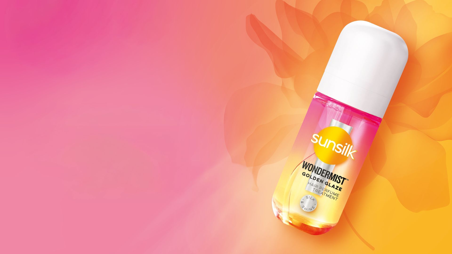La nuova hair mist WonderMist di Sunsilk nella variante Golden Glaze. Un piccolo flacone spray rosa e arancione su uno sfondo rosa e arancione.